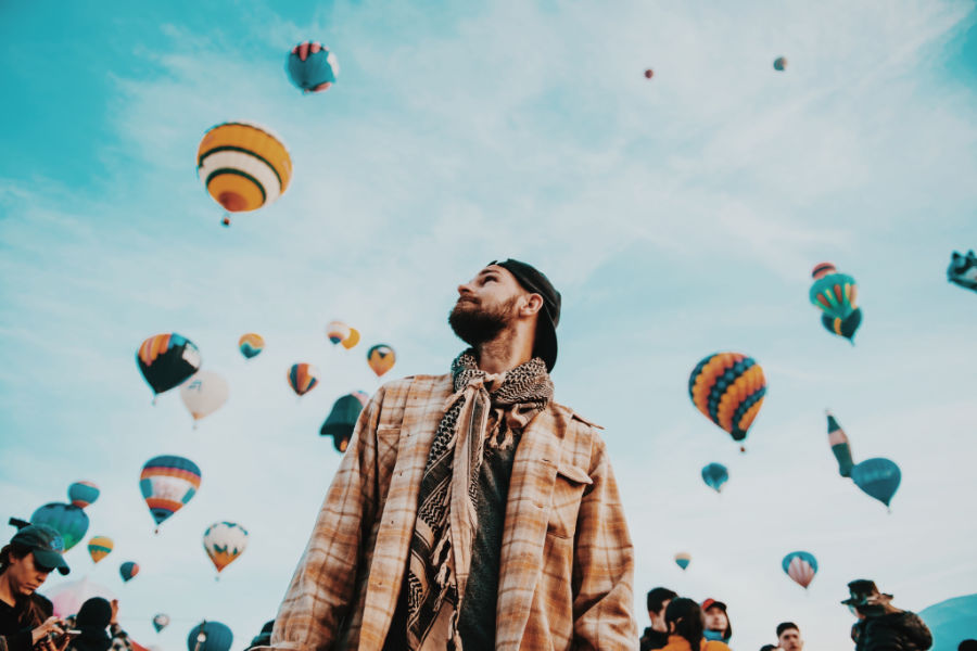 man at hot air balloon festival