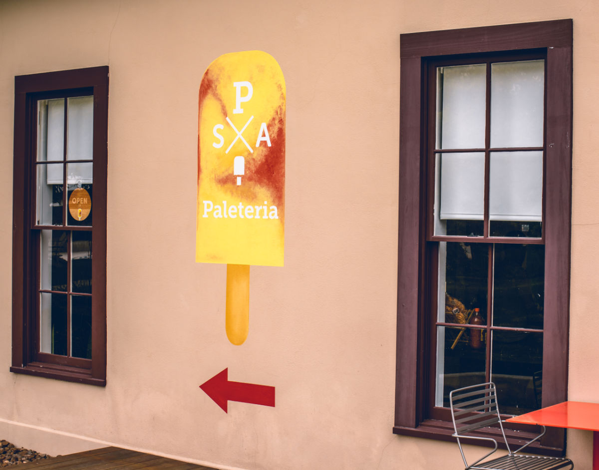 Paleteria popsicle sign painted on local building